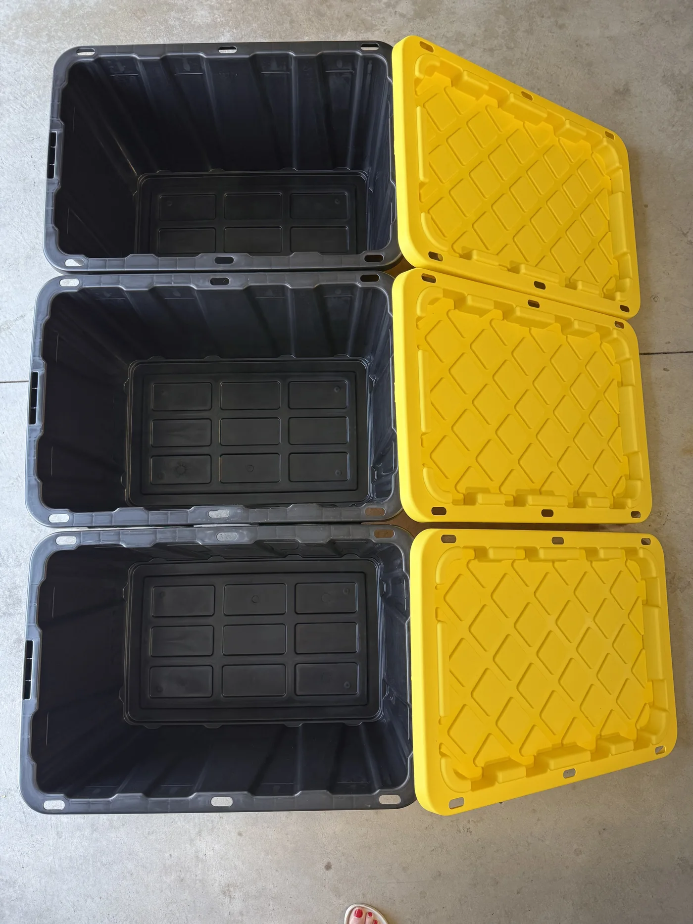 Three clean Tubby Tyler totes shown open with their yellow hinged lids